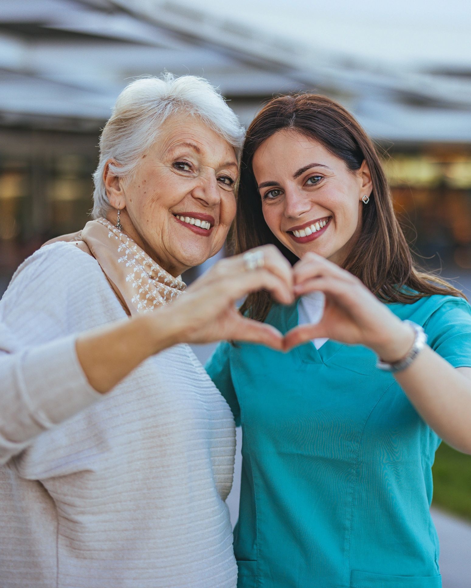 Caring home care professional assisting a senior at home