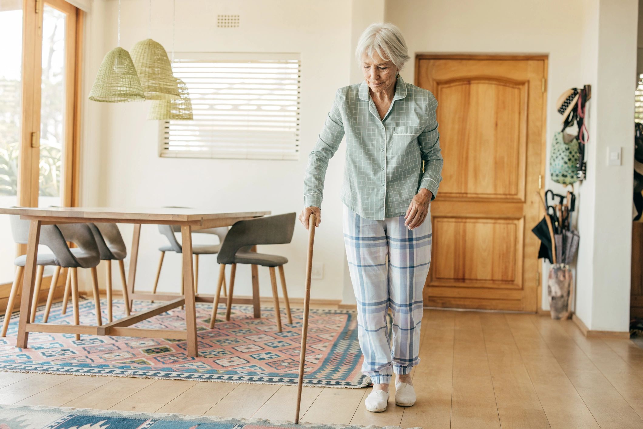 Home care aide doing light housekeeping for elderly