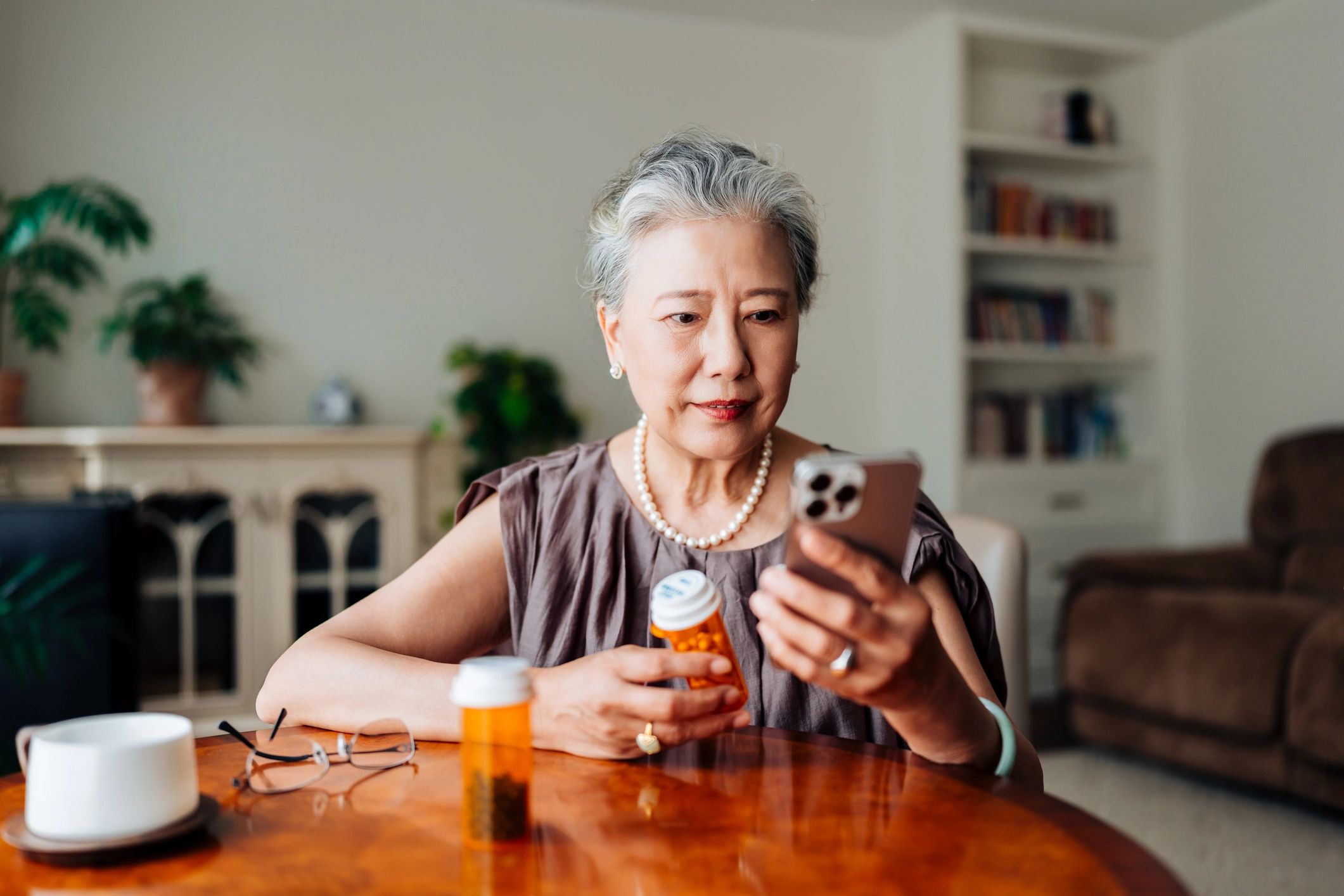 Caregiver assisting with medication reminders